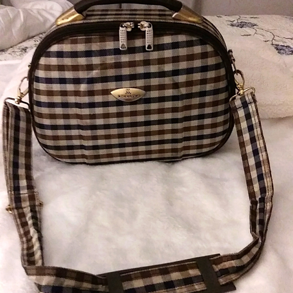 This is a handbag made in London by a certain designer. It's a cloth-like.